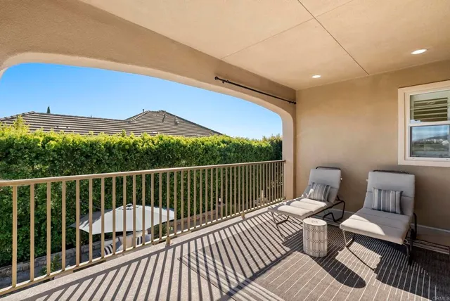 a view of patio with a table and chairs under an umbrella