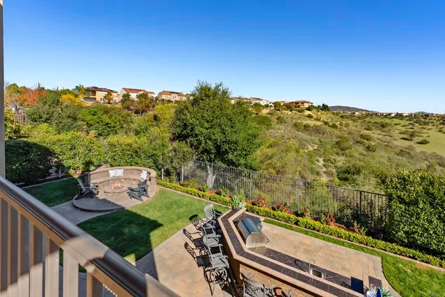 a view of a patio with couches and a fire pit
