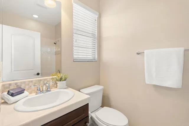 a view of a chairs and table in the patio
