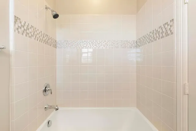 a view of a patio with couches table and chairs with potted plants