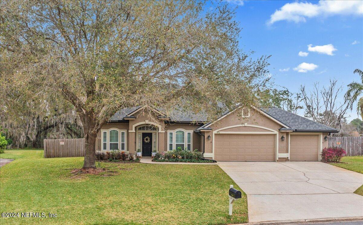 11322 Mandarin Ridge Lane Jacksonville, FL 32258 - Photo 1 of 37 a front view of a house with yard and green space