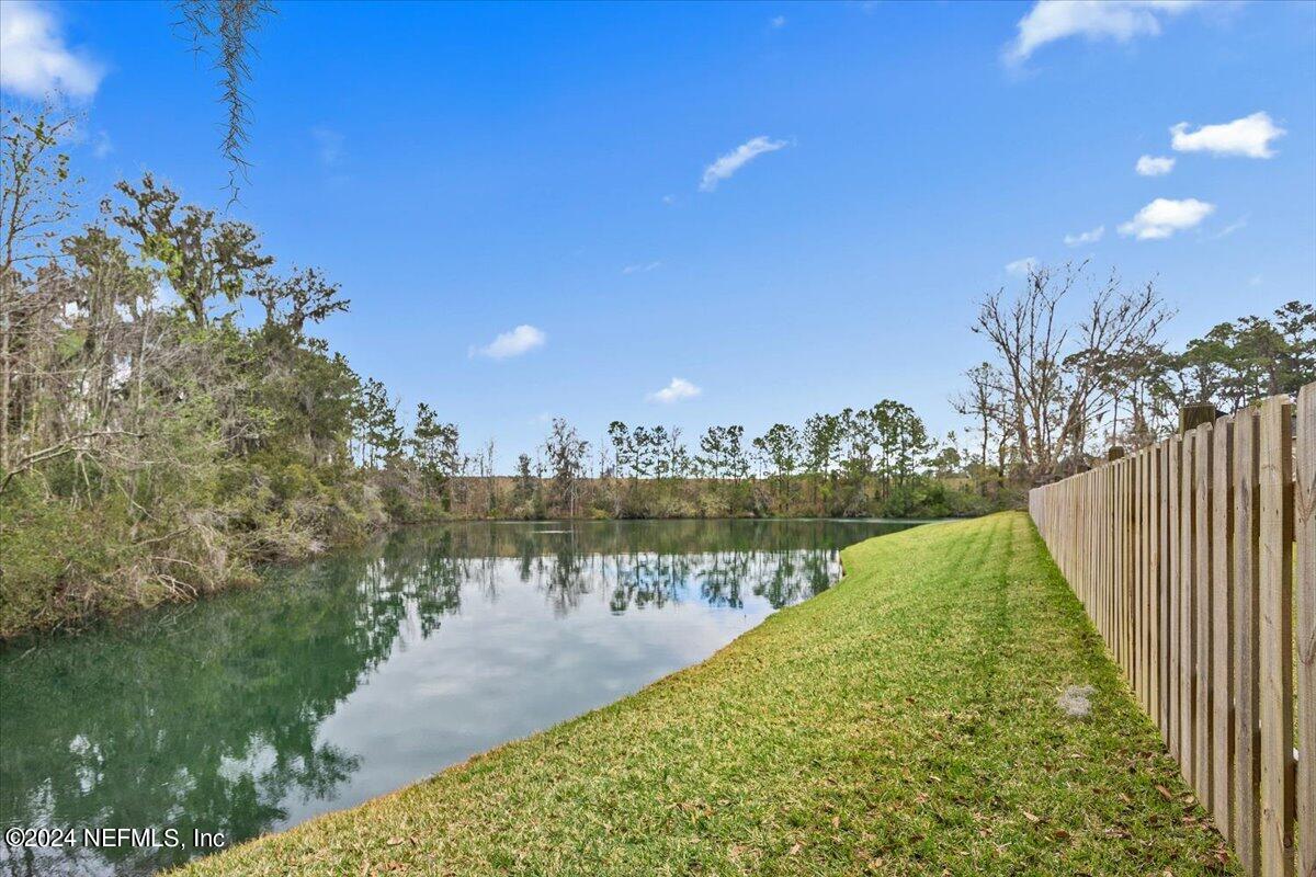 11322 Mandarin Ridge Lane Jacksonville, FL 32258 - Photo 20 of 37 a view of a lake with a garden
