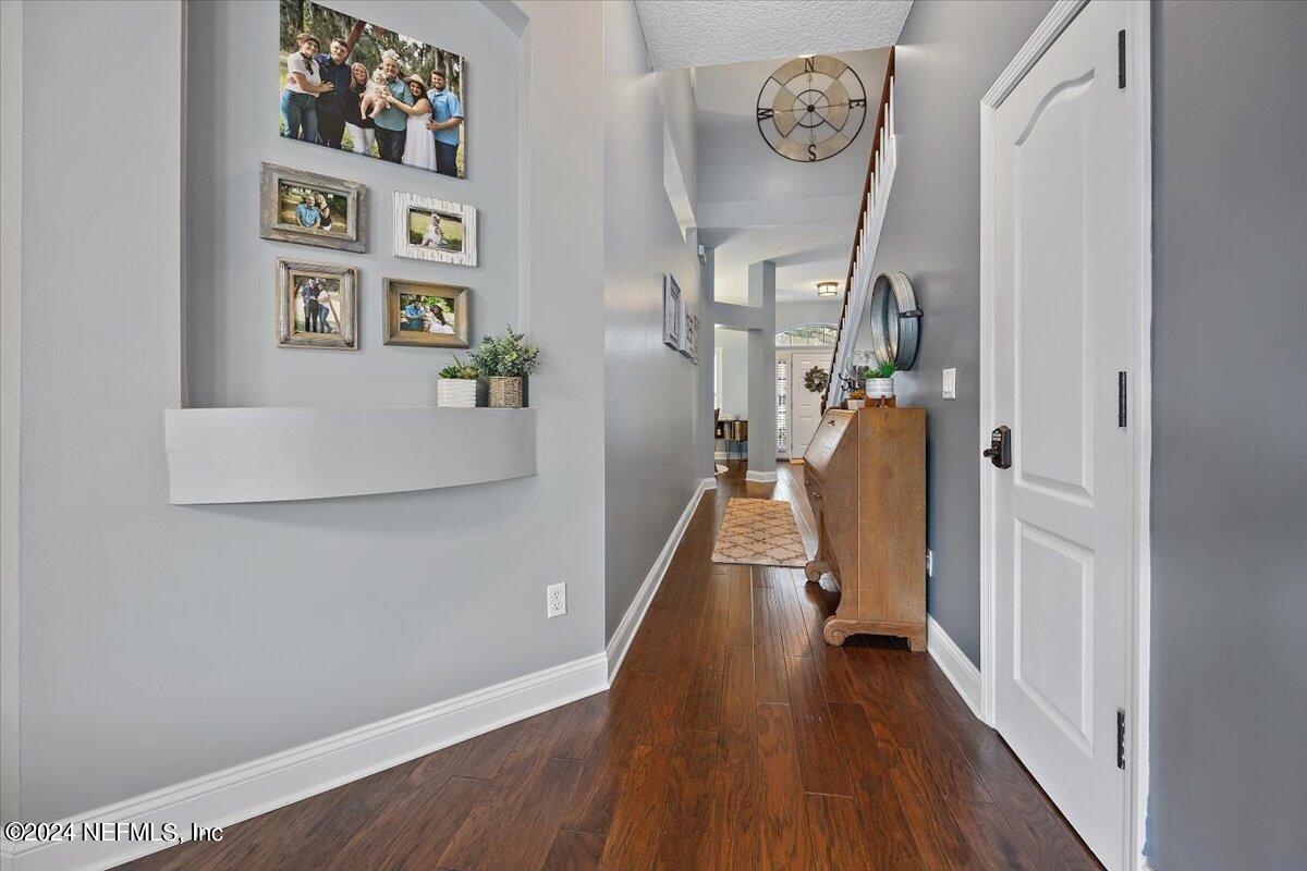 11322 Mandarin Ridge Lane Jacksonville, FL 32258 - Photo 23 of 37 a view of hallway with wooden floor