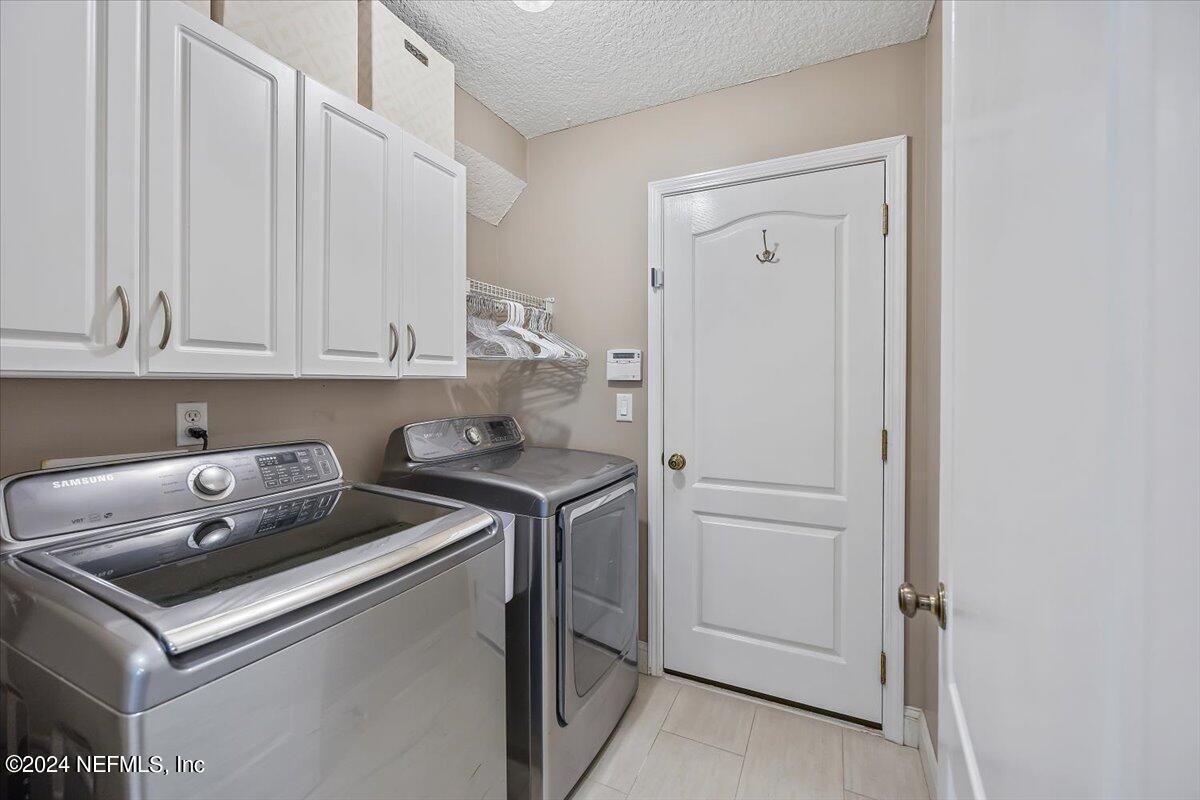 11322 Mandarin Ridge Lane Jacksonville, FL 32258 - Photo 26 of 37 a utility room with dryer and washer