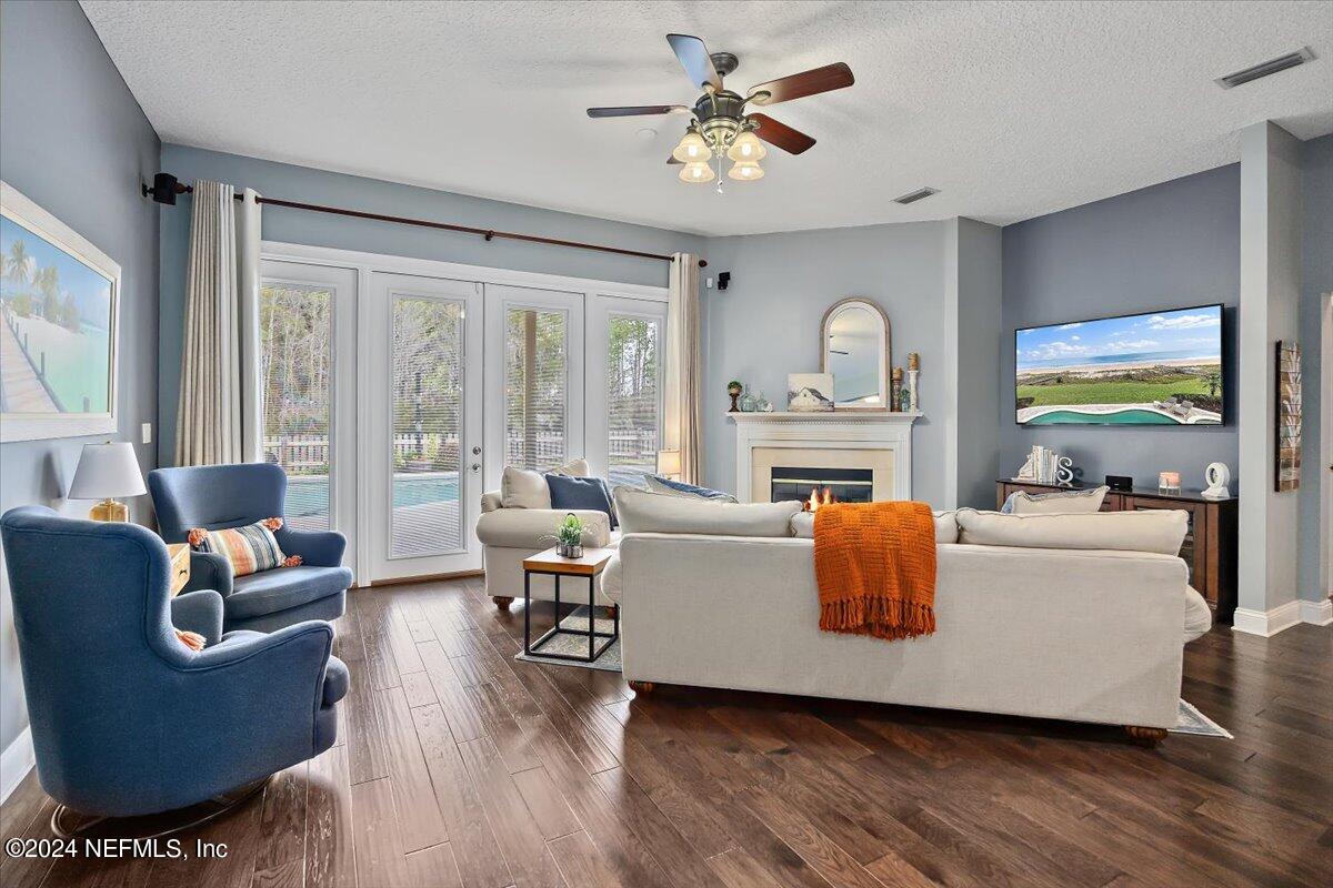 11322 Mandarin Ridge Lane Jacksonville, FL 32258 - Photo 28 of 37 a living room with furniture and a fireplace