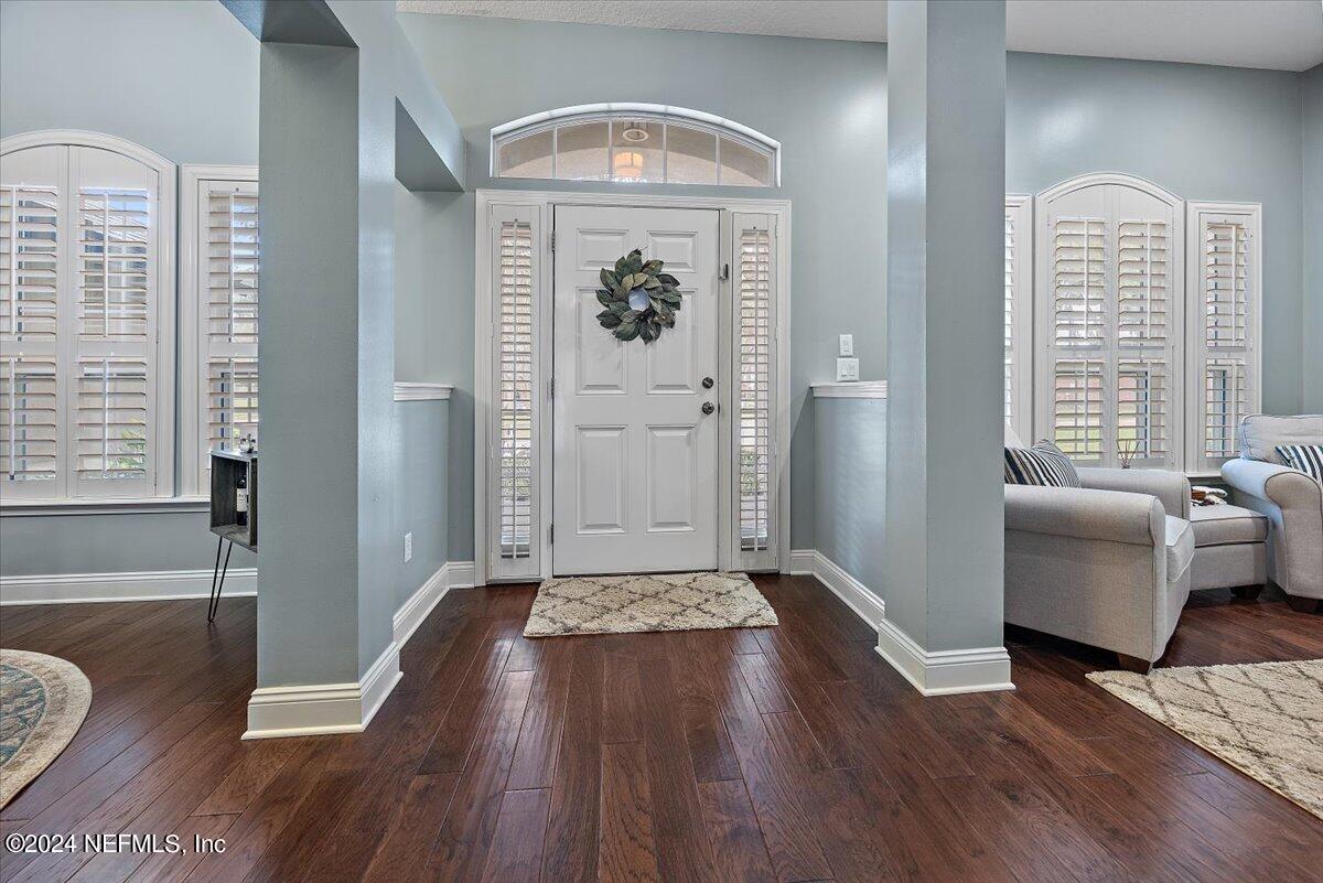 11322 Mandarin Ridge Lane Jacksonville, FL 32258 - Photo 3 of 37 wooden floor in an empty room with a window