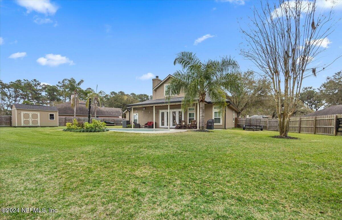 11322 Mandarin Ridge Lane Jacksonville, FL 32258 - Photo 32 of 37 a view of a big yard with a house
