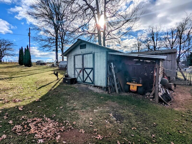 6785 Conner Road Northeast Copper Hill, VA 24079 - Photo 21 of 27 a view of a house with backyard and trees