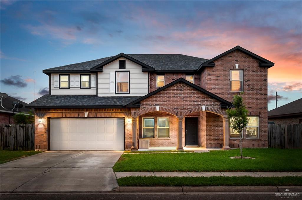 1322 Candy Lane Edinburg, TX 78539 - Photo 1 of 1 a front view of a house with a yard and garage