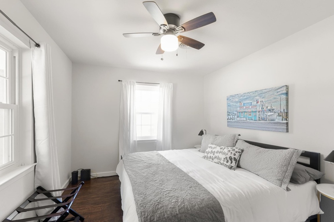 219 Bluff Street Dripping Springs, TX 78620 - Photo 16 of 40 a bedroom with a bed and a window