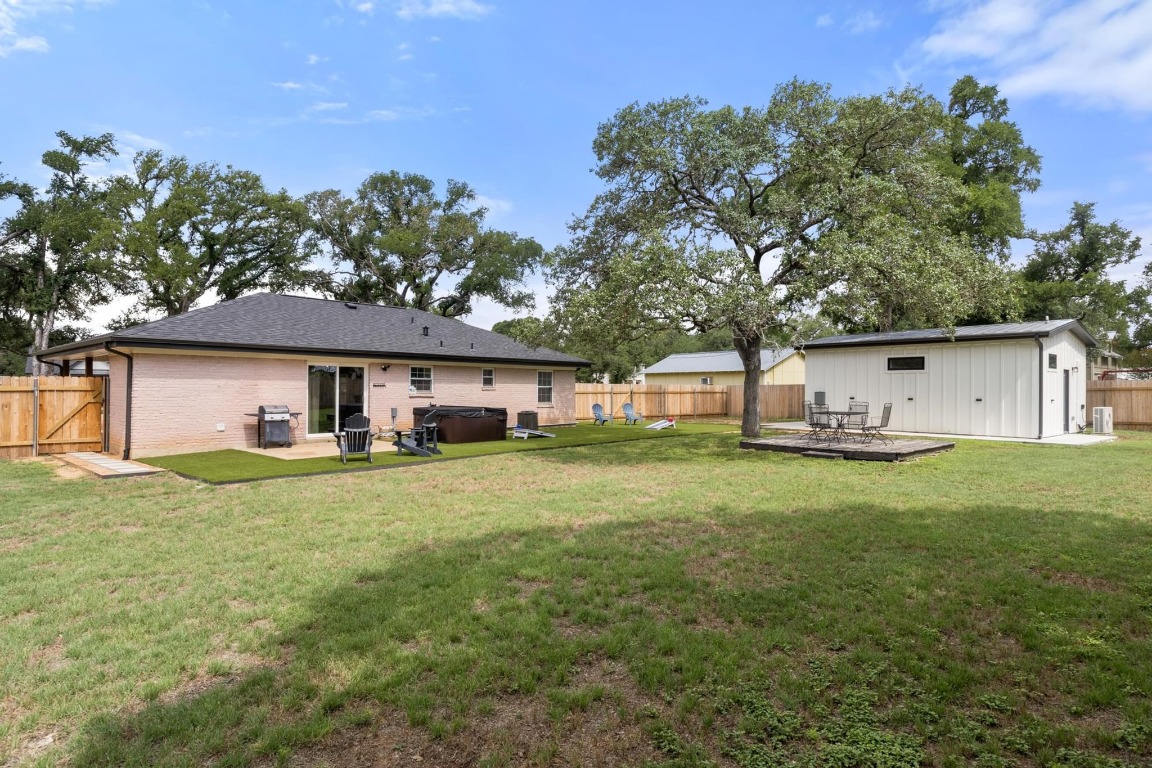 219 Bluff Street Dripping Springs, TX 78620 - Photo 19 of 40 front view of a house with a yard