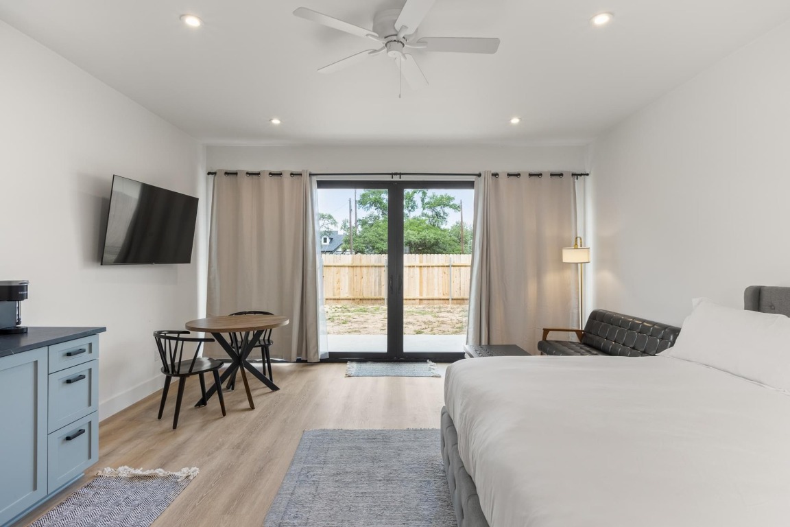 219 Bluff Street Dripping Springs, TX 78620 - Photo 26 of 40 a bedroom with a bed and a flat screen tv