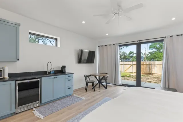 a view of a livingroom with furniture workspace and a window