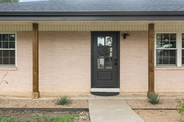 a front view of a house with garage