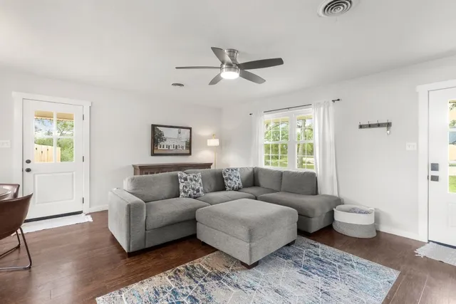 a living room with furniture and a window