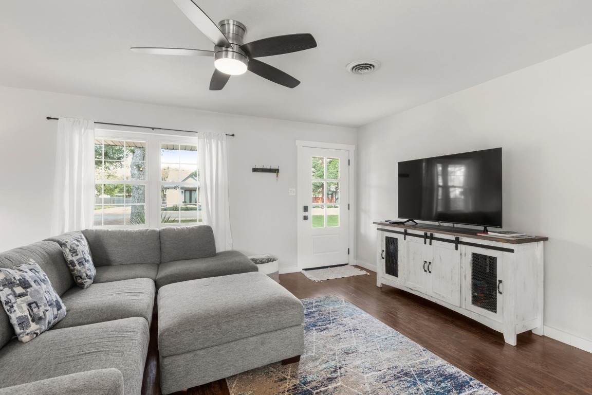 219 Bluff Street Dripping Springs, TX 78620 - Photo 8 of 40 a living room with furniture and a flat screen tv