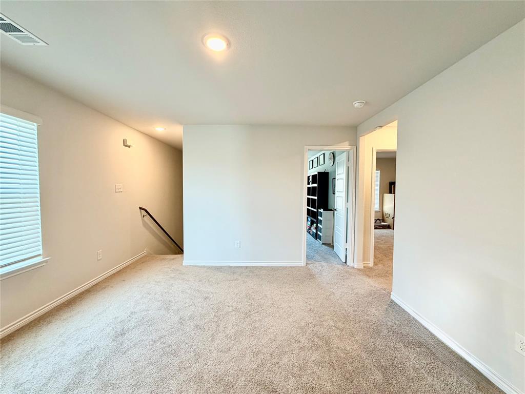 5664 Shore Point Trail Fort Worth, TX 76119 - Photo 12 of 29 a view of an empty room with a window