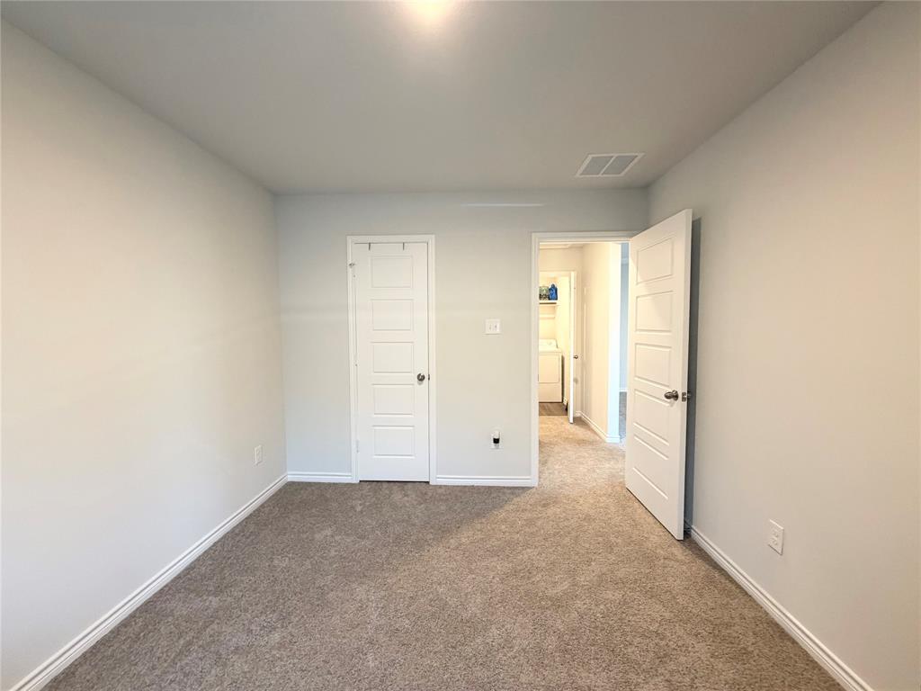 5664 Shore Point Trail Fort Worth, TX 76119 - Photo 22 of 29 a view of an empty room