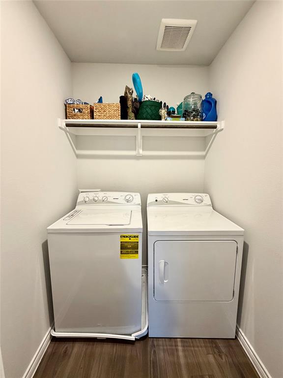 5664 Shore Point Trail Fort Worth, TX 76119 - Photo 23 of 29 a utility room with washer and dryer