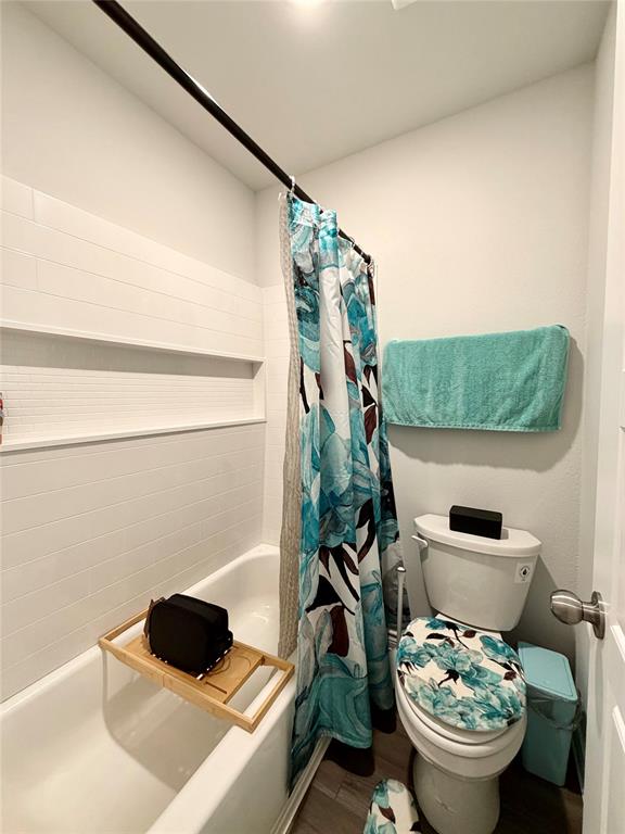 5664 Shore Point Trail Fort Worth, TX 76119 - Photo 25 of 29 a bathroom with a toilet and a sink