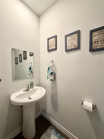 a bathroom with a sink and mirror