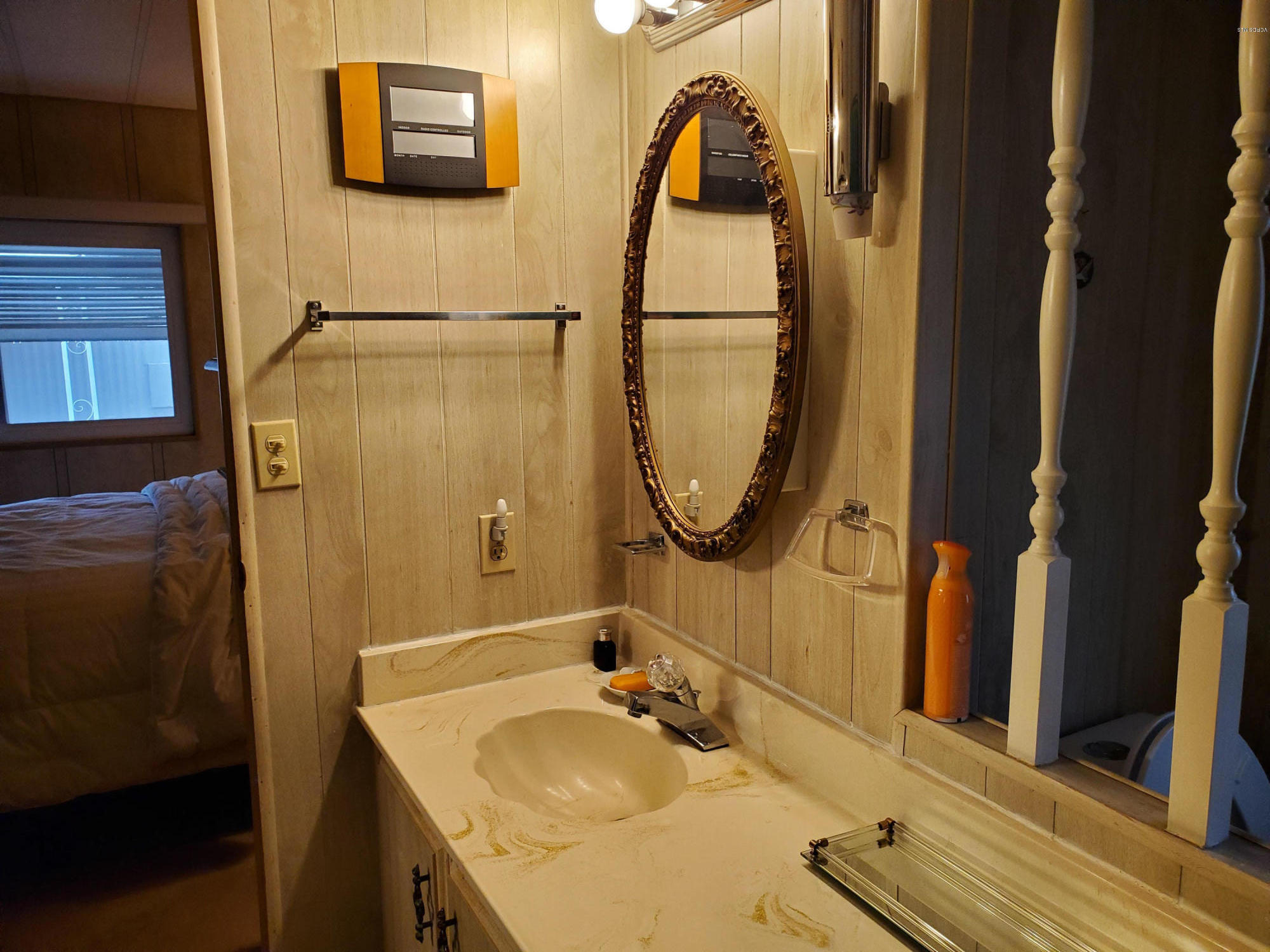 6480 Katherine Road, Unit 132 Simi Valley, CA 93063 - Photo 23 of 38 a bathroom with a sink and a mirror