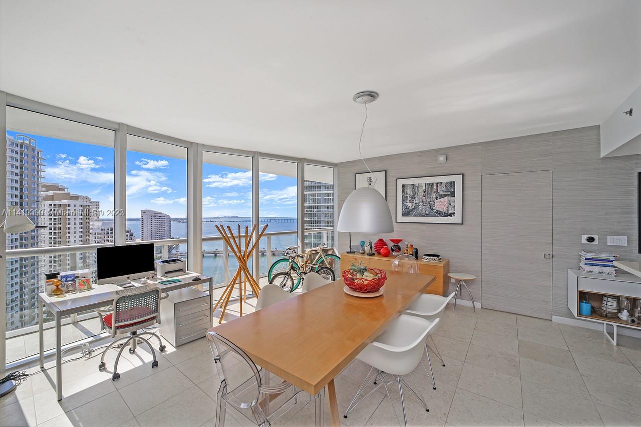 465 Brickell Avenue, Unit 2001 Miami, FL 33131 - Photo 13 of 62 a view of a livingroom with furniture and a flat screen tv