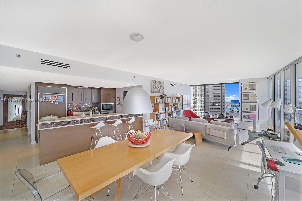 465 Brickell Avenue, Unit 2001 Miami, FL 33131 - Photo 14 of 62 a living room with furniture and a wooden floor
