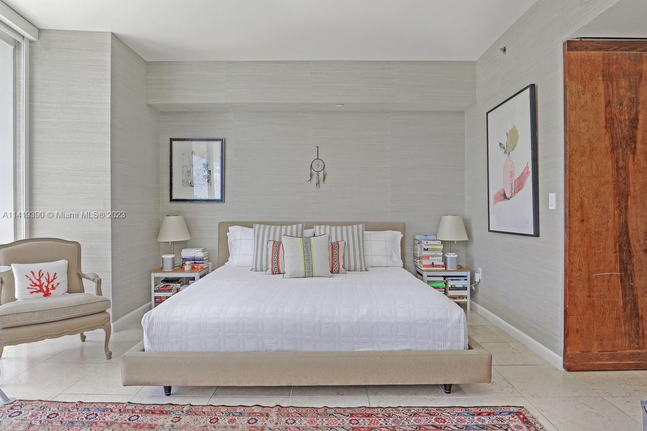 465 Brickell Avenue, Unit 2001 Miami, FL 33131 - Photo 27 of 62 a bedroom with a bed and a couch