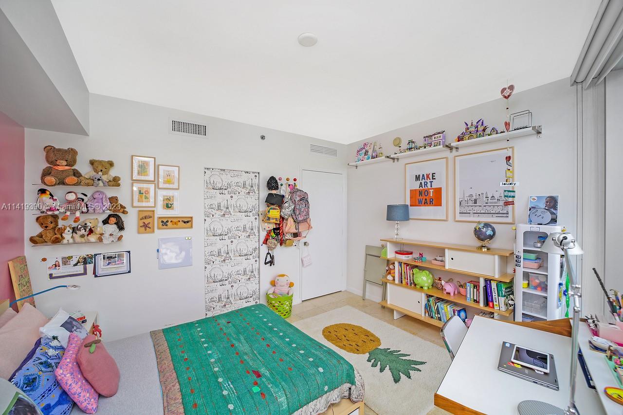 465 Brickell Avenue, Unit 2001 Miami, FL 33131 - Photo 39 of 62 a children room with furniture and toys