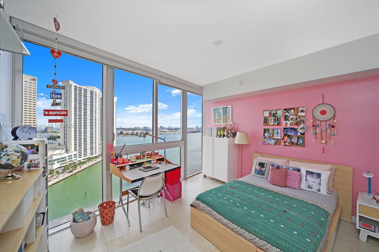 465 Brickell Avenue, Unit 2001 Miami, FL 33131 - Photo 40 of 62 a living room with furniture and a floor to ceiling window
