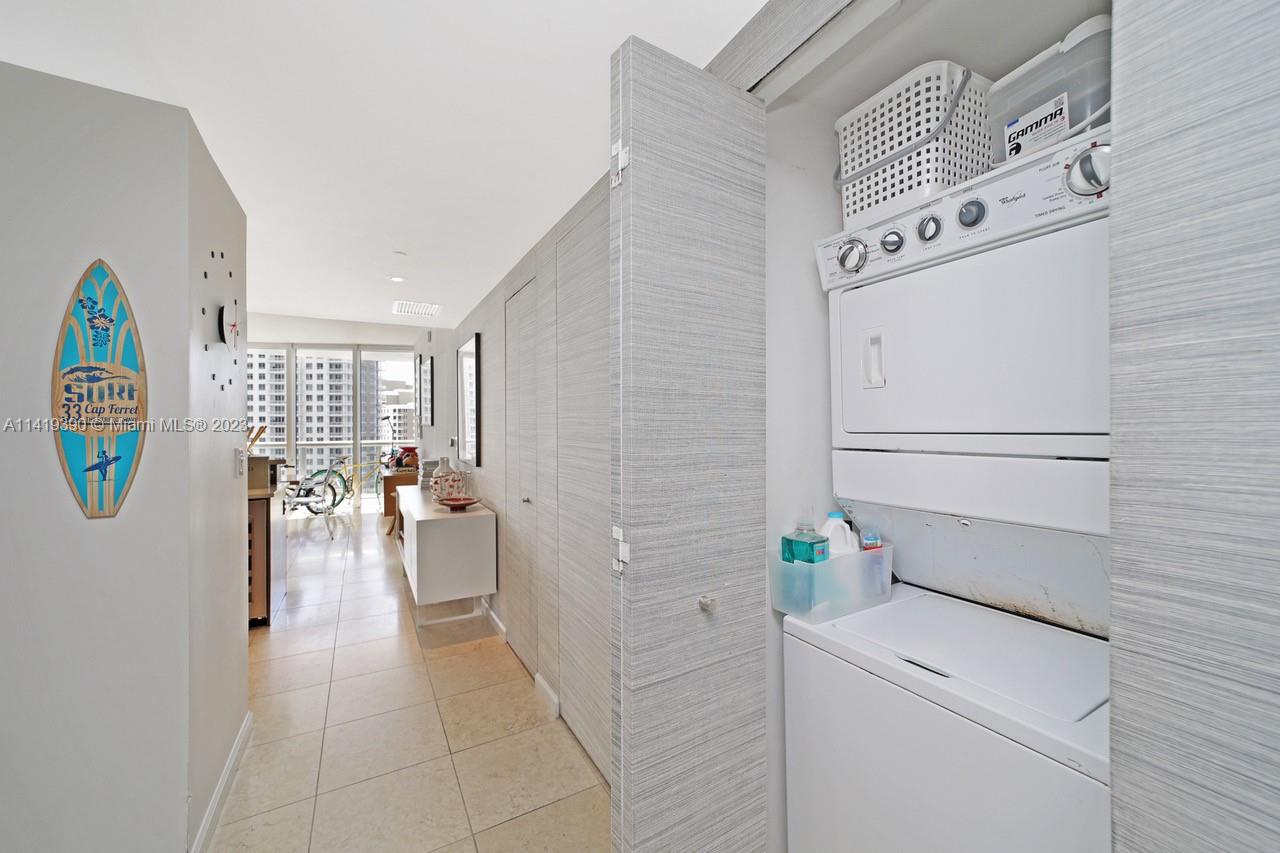 465 Brickell Avenue, Unit 2001 Miami, FL 33131 - Photo 41 of 62 a view of storage and utility room with washer and dryer