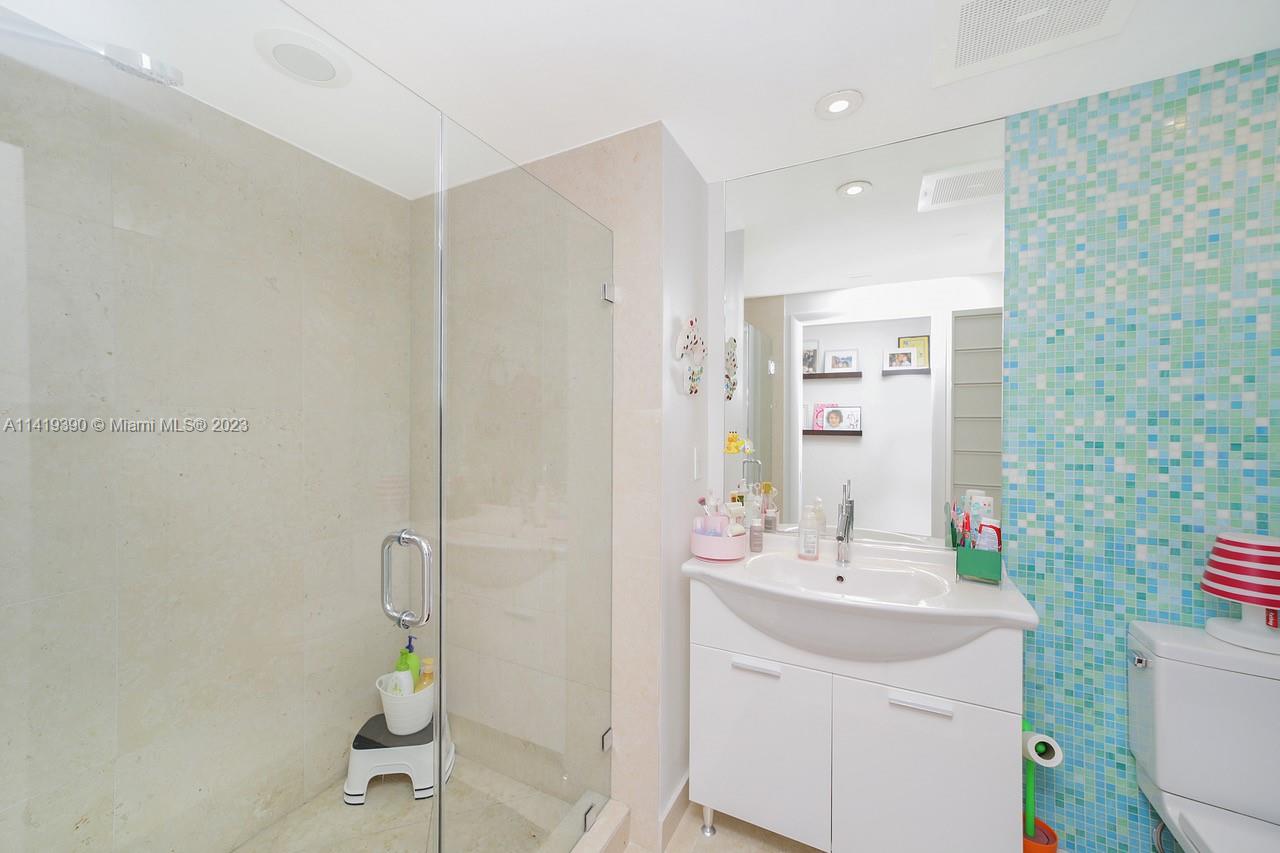 465 Brickell Avenue, Unit 2001 Miami, FL 33131 - Photo 42 of 62 a bathroom with a sink toilet and shower