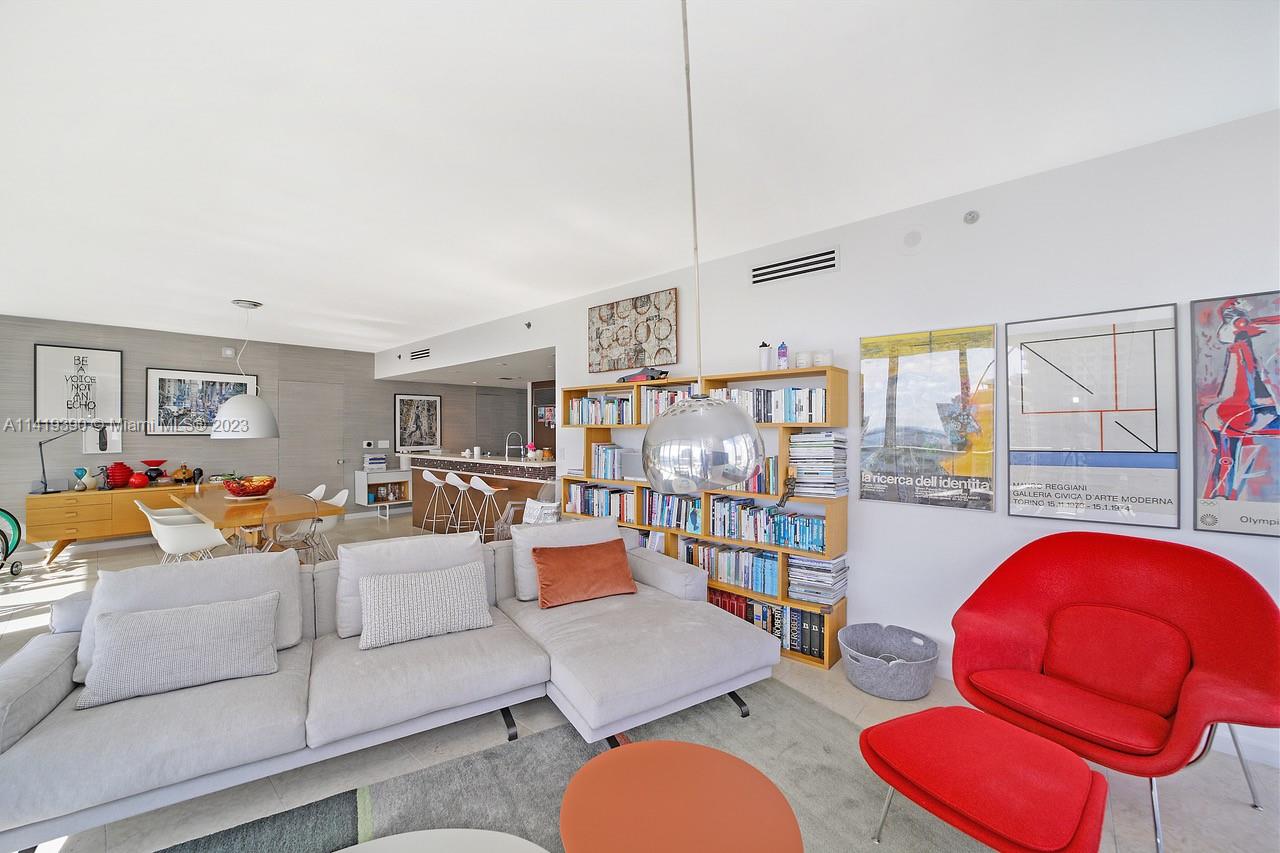 465 Brickell Avenue, Unit 2001 Miami, FL 33131 - Photo 7 of 62 a living room with furniture and a floor to ceiling window