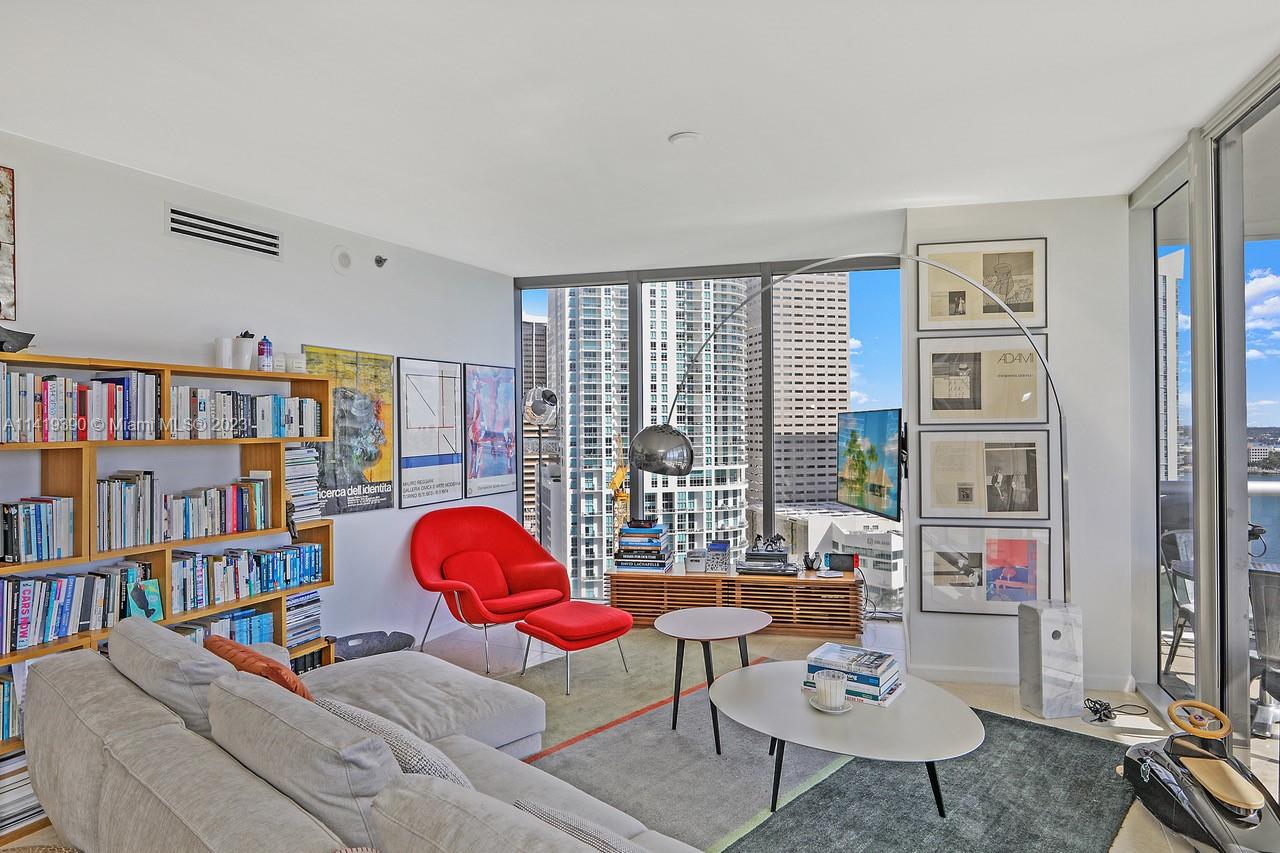 465 Brickell Avenue, Unit 2001 Miami, FL 33131 - Photo 10 of 62 a living room with furniture and a book shelf