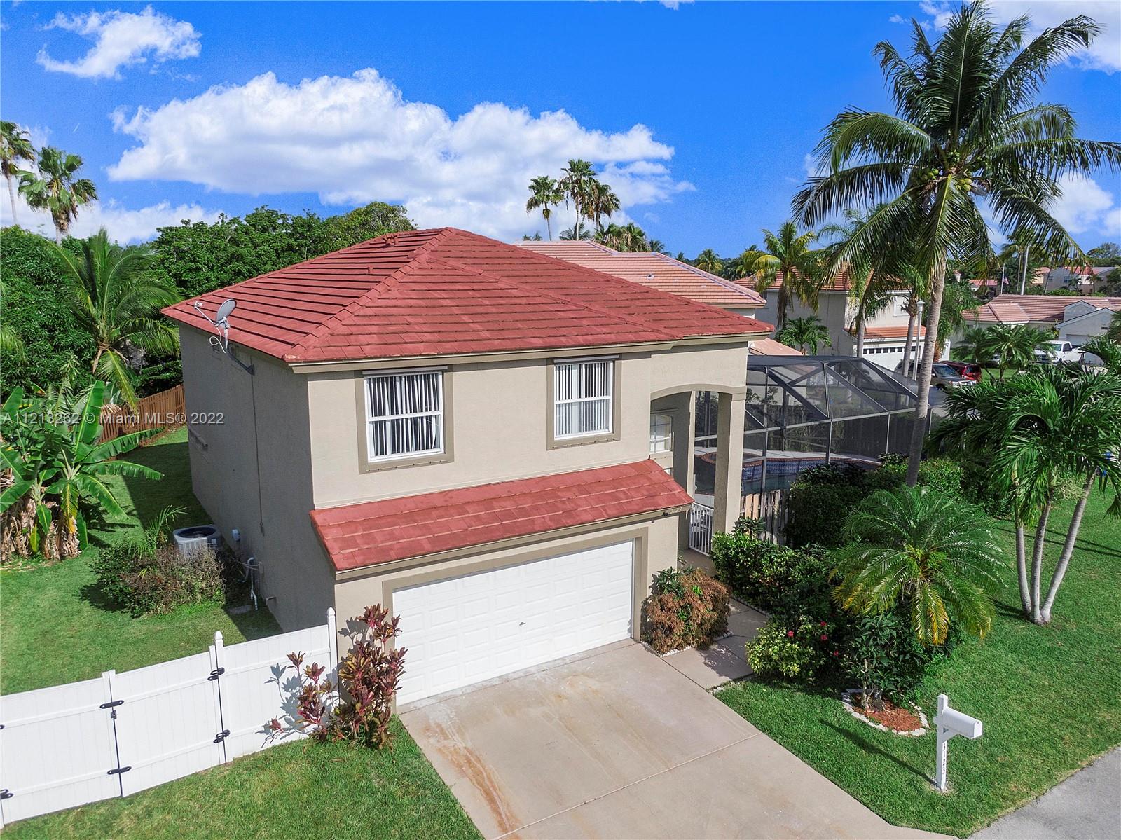 3123 Sunset Circle Margate, FL 33063 - Photo 1 of 58 a front view of a house with a yard