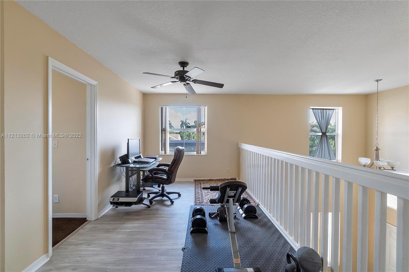 3123 Sunset Circle Margate, FL 33063 - Photo 23 of 58 a view of a livingroom with workspace and a window