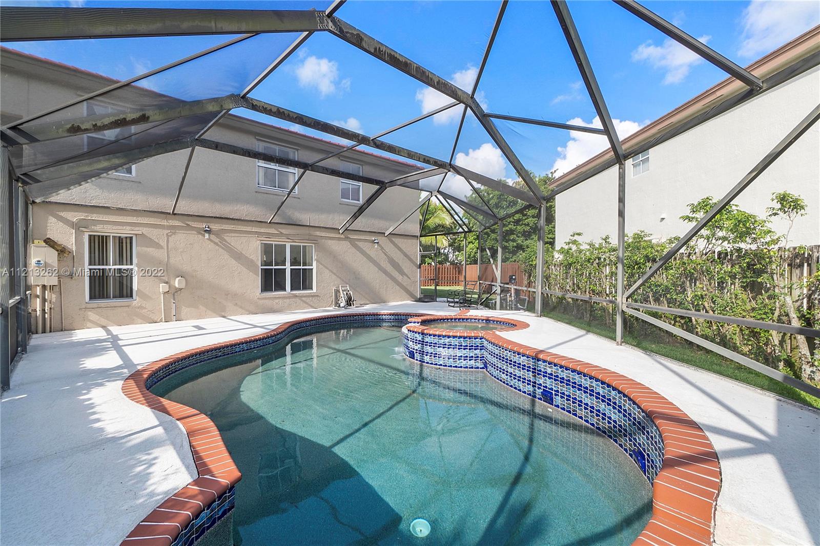 3123 Sunset Circle Margate, FL 33063 - Photo 35 of 58 a view of a house with pool and sitting area