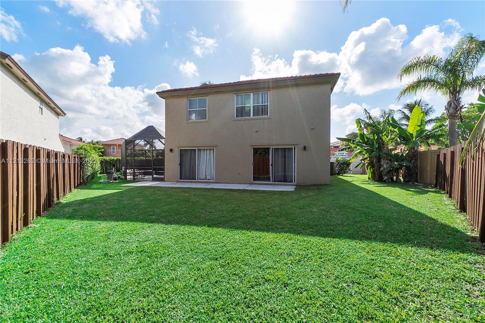 3123 Sunset Circle Margate, FL 33063 - Photo 40 of 58 a view of a house with backyard and a tree