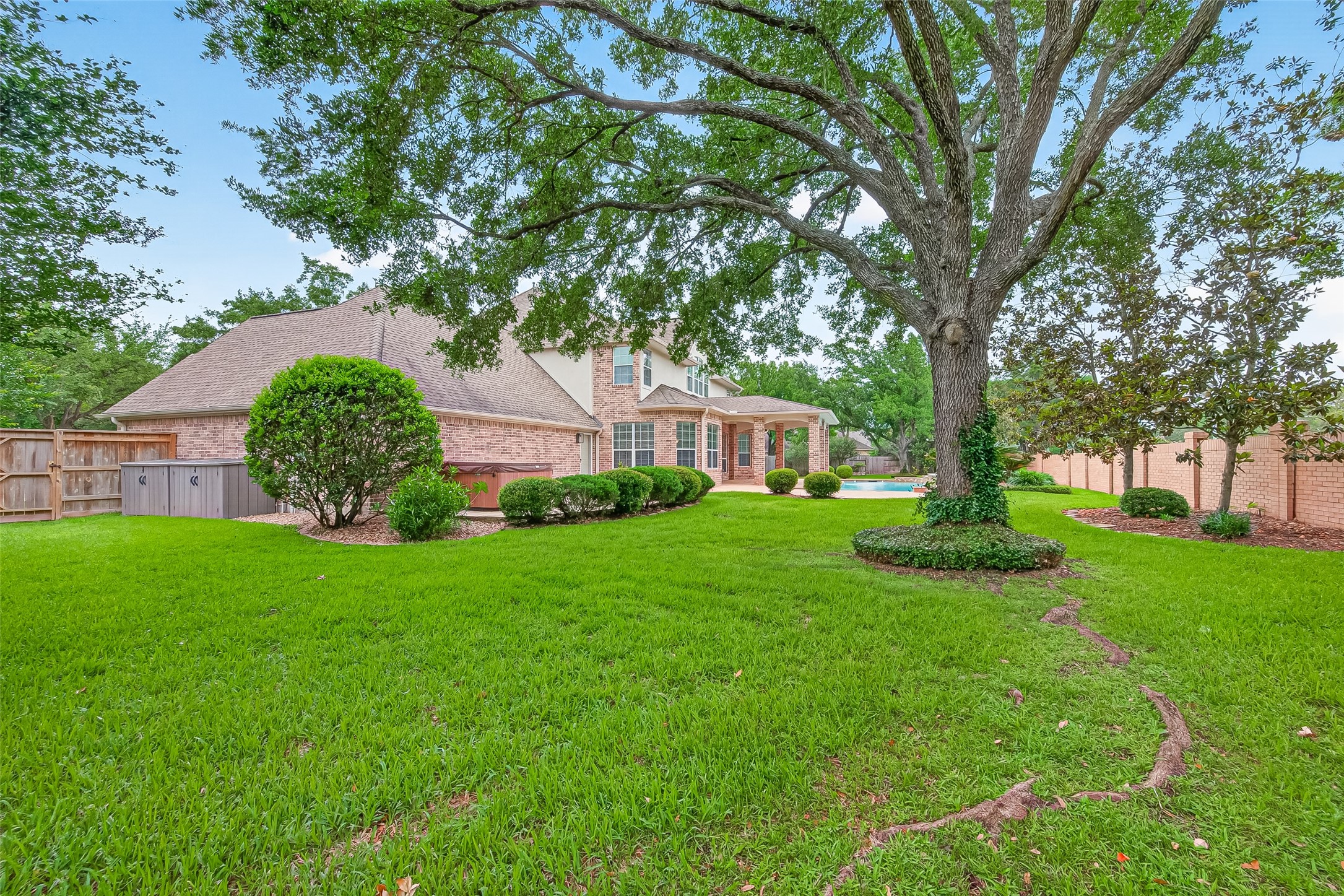 4203 Deforest Ridge Circle Katy, TX 77494 - Photo 45 of 50 Alternate view of this inviting backyard which also has a vegetable bed with connection to the sprinkler system and 2 storage sheds on the side of the garage