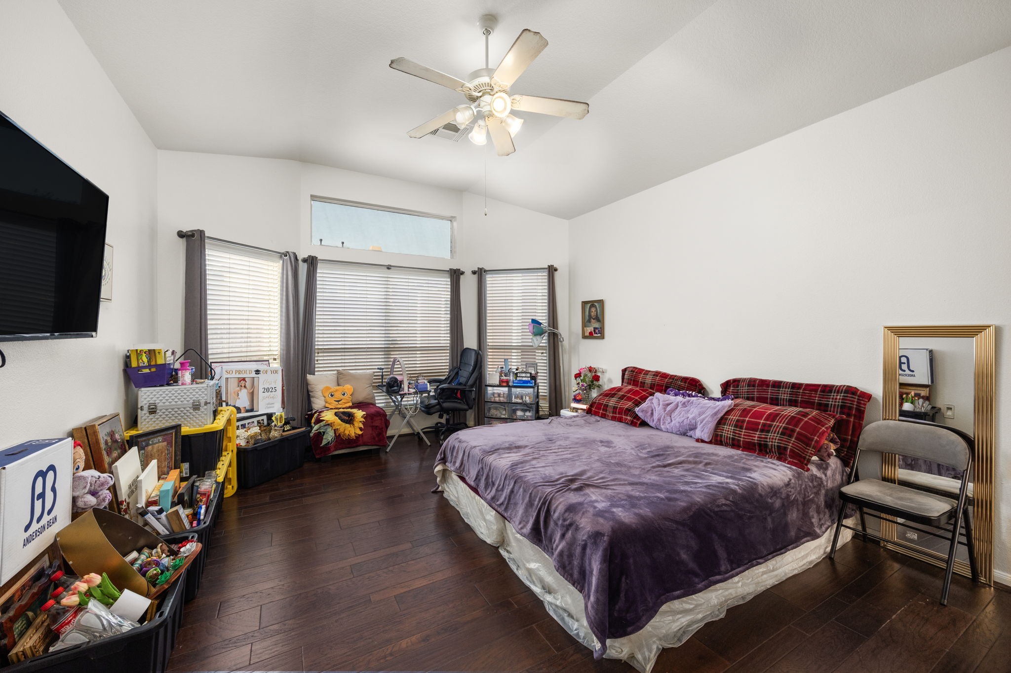 927 Spring Source Place Spring, TX 77373 - Photo 18 of 37 a spacious bedroom with a bed and a chandelier