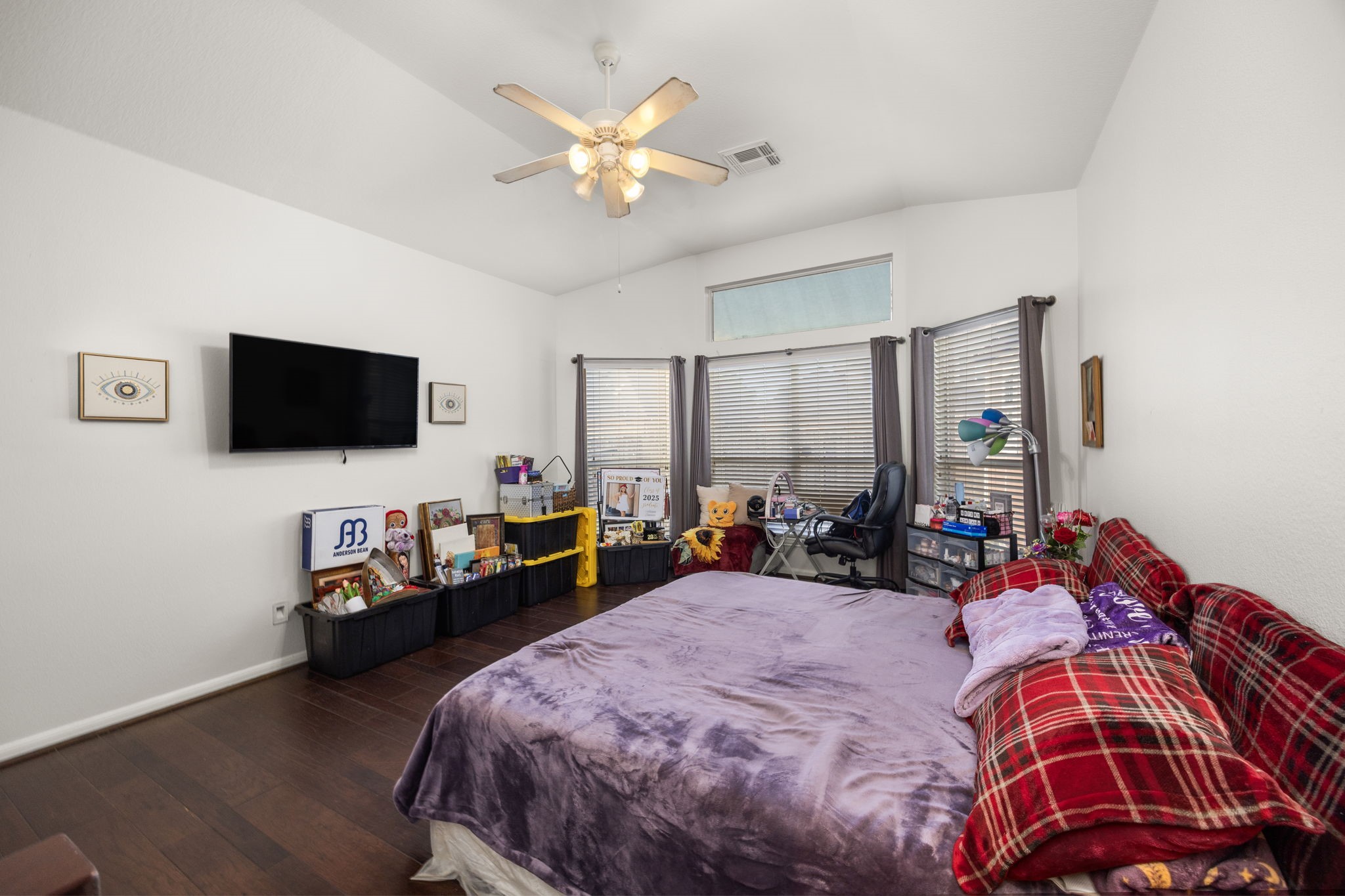 927 Spring Source Place Spring, TX 77373 - Photo 19 of 37 a bed room with a bed window and a flat screen tv