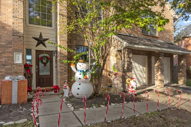 a backyard of a house with outdoor seating