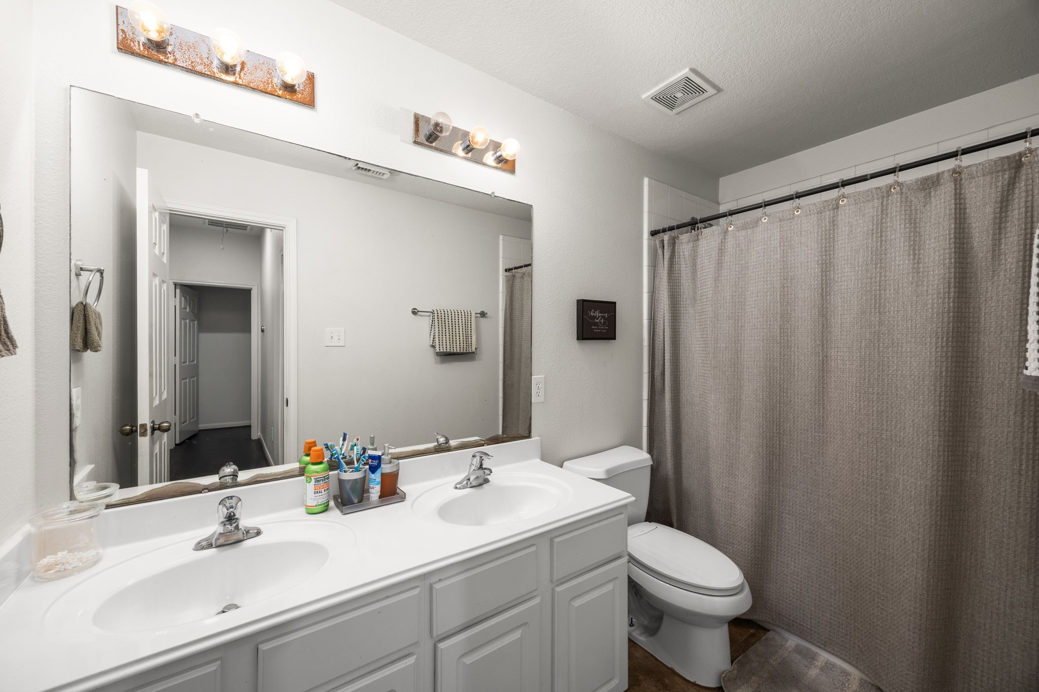 927 Spring Source Place Spring, TX 77373 - Photo 23 of 37 a bathroom with a sink and a mirror