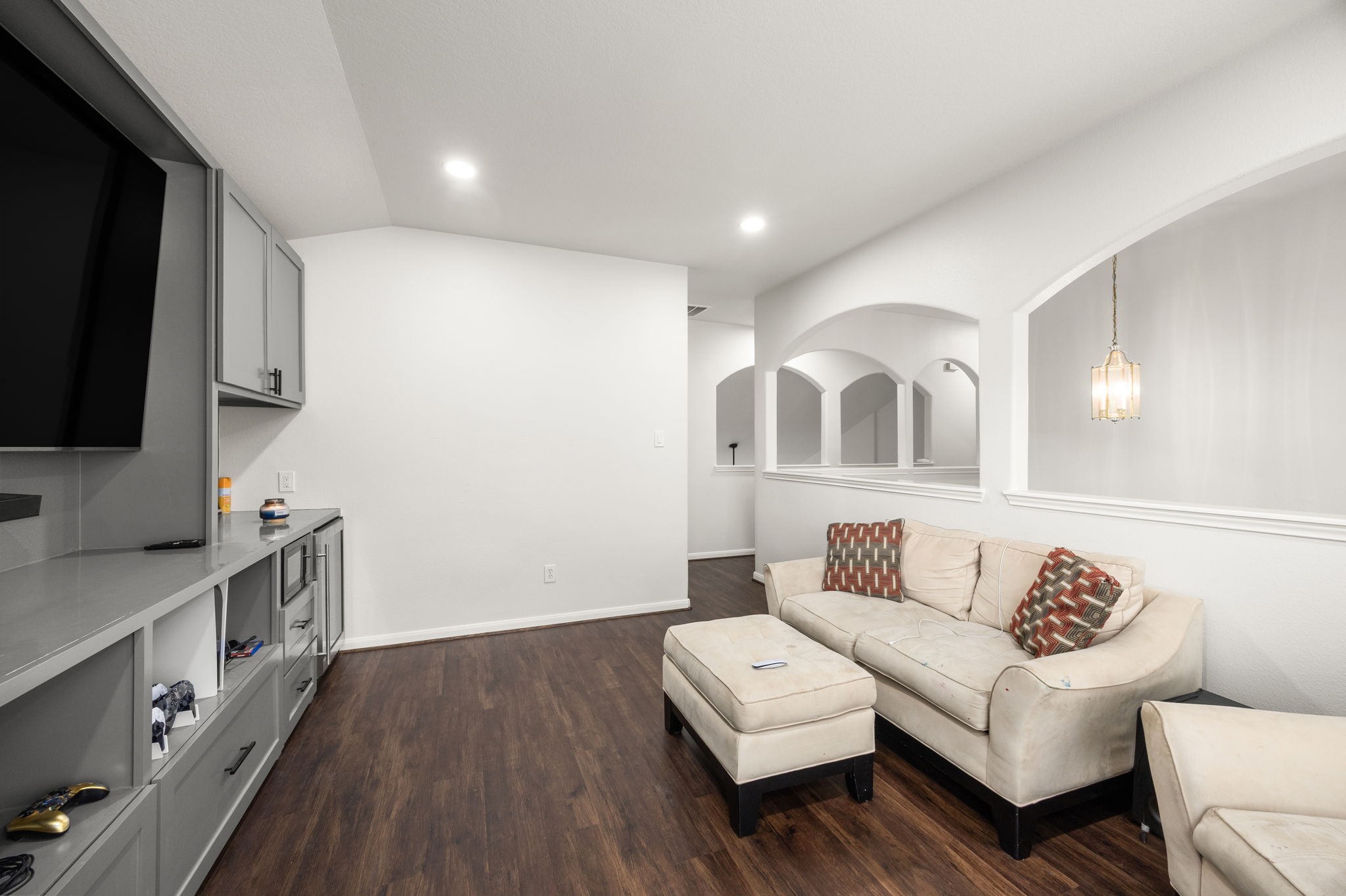 927 Spring Source Place Spring, TX 77373 - Photo 27 of 37 a living room with furniture and a flat screen tv