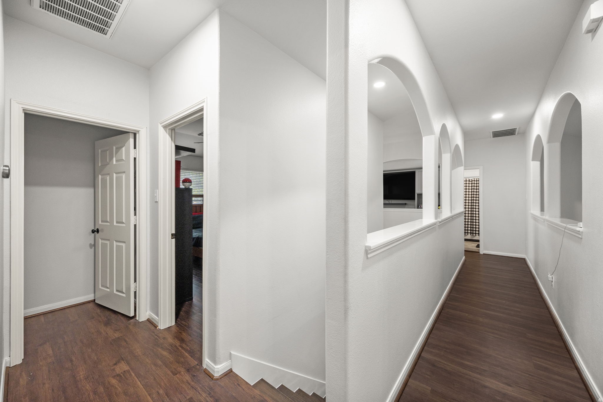 927 Spring Source Place Spring, TX 77373 - Photo 29 of 37 a view of a hallway with wooden floor