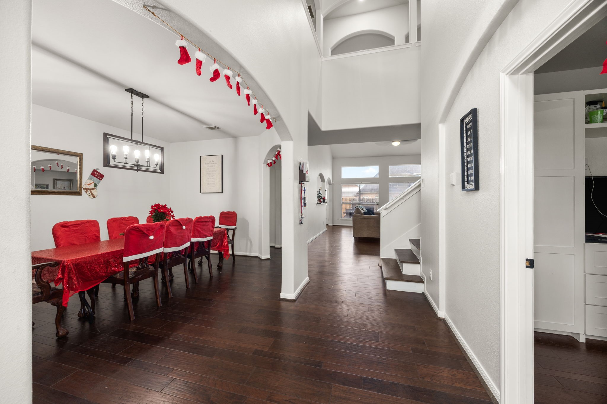 927 Spring Source Place Spring, TX 77373 - Photo 3 of 37 a view of a dining room with furniture and wooden floor