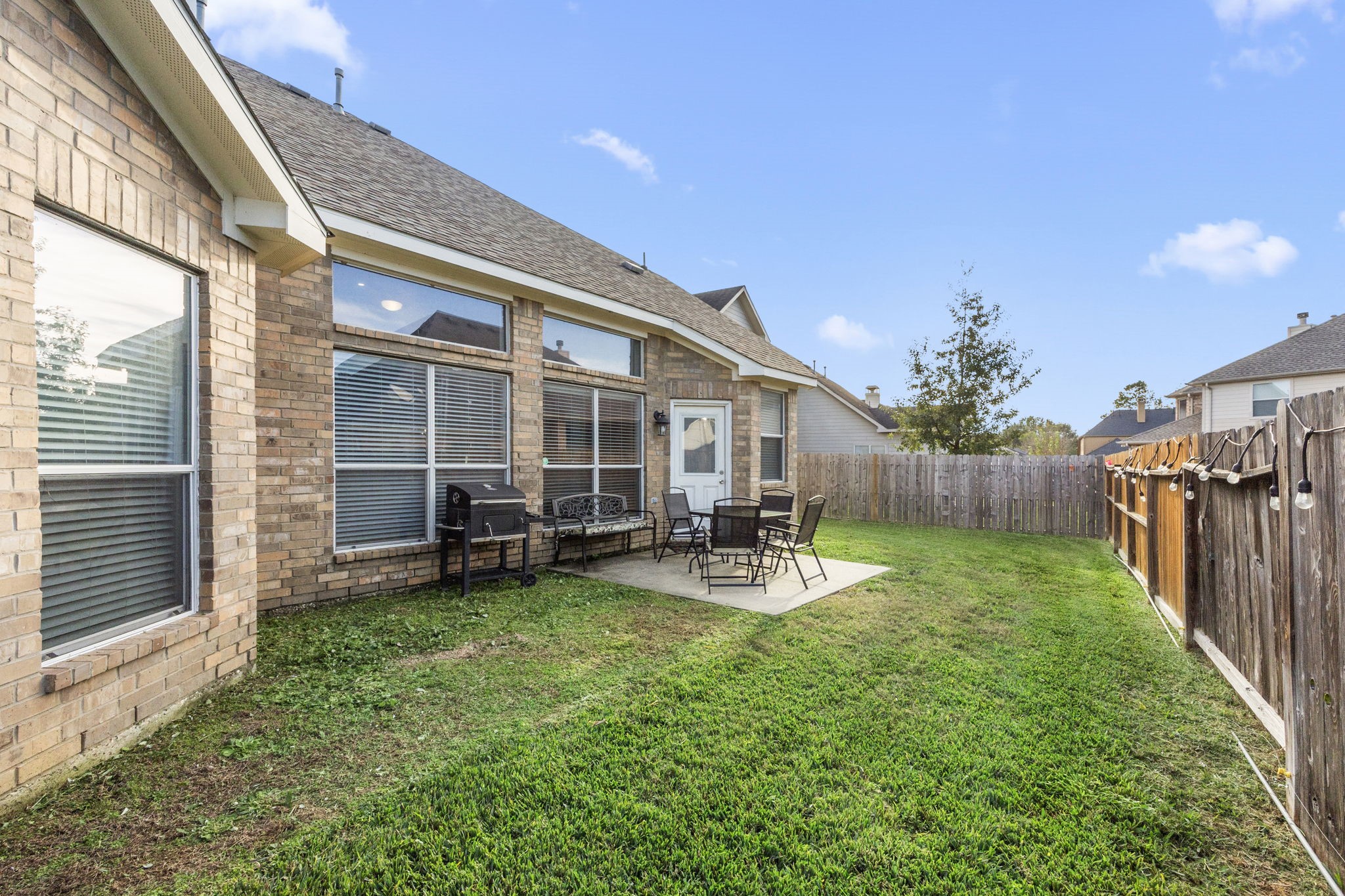 927 Spring Source Place Spring, TX 77373 - Photo 32 of 37 a view of a house with backyard porch and sitting area