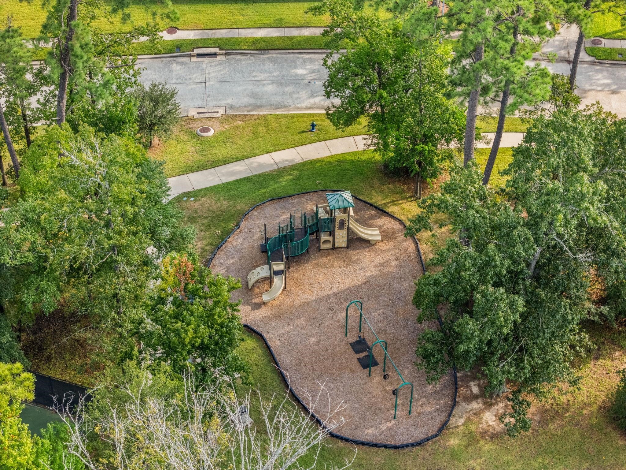 927 Spring Source Place Spring, TX 77373 - Photo 34 of 37 a view of a swimming pool with a yard