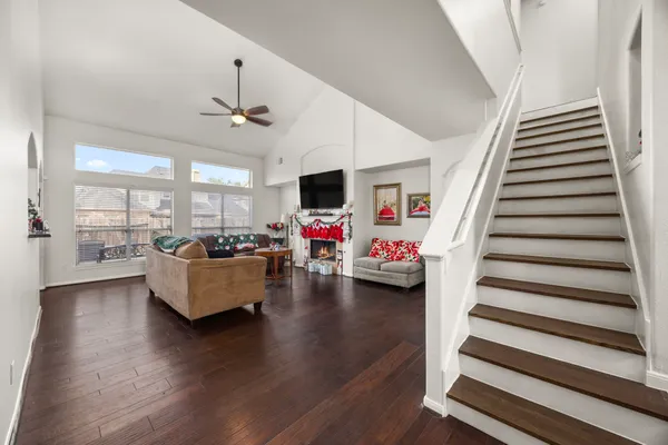 a bedroom with a bed and a flat tv screen on dresser
